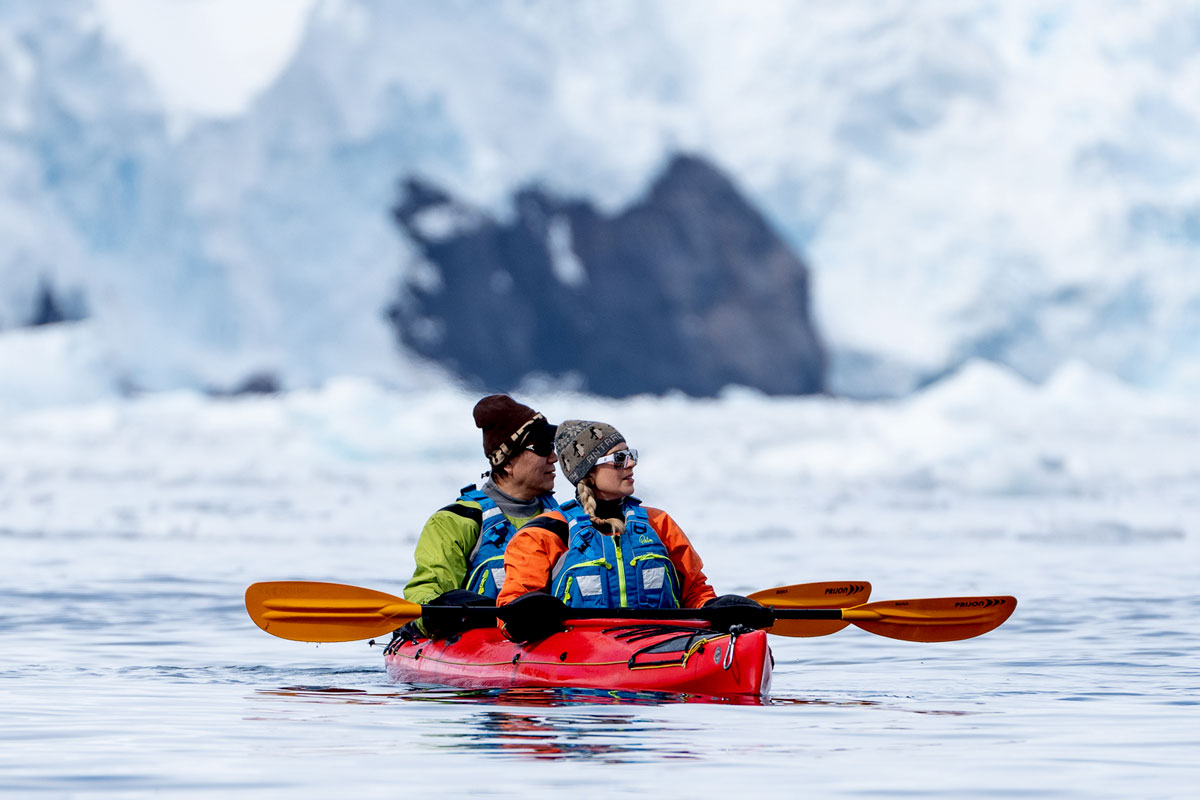 Woman in yellow bikini does the polar plunge in Antarctica